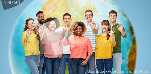 Image of international group of happy people showing ok