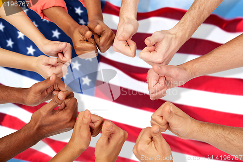 Image of hands of international people showing thumbs up