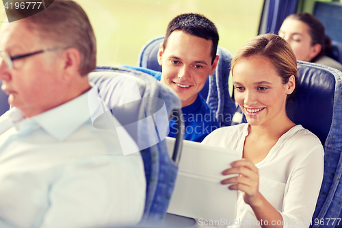 Image of happy couple with tablet pc in travel bus