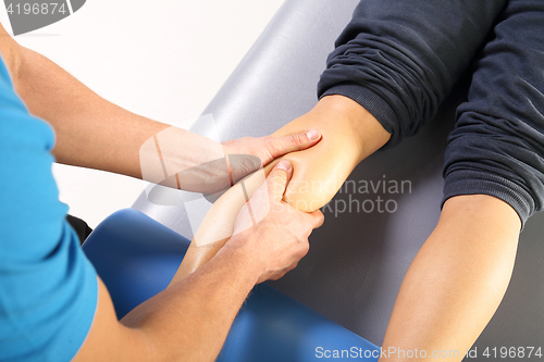 Image of A physiotherapist massaged patient&#39;s leg. Physiotherapy. Massage. Masseur massaged his calf.