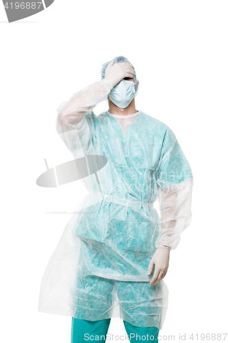 Image of Surgeon portrait. covered face with his hands. sad. isolated on white background