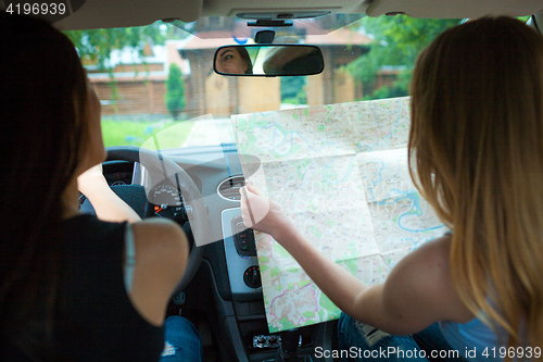 Image of Two girls traveling in a car