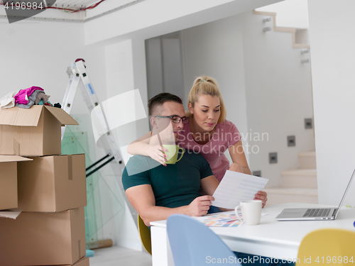 Image of Young couple moving in a new home