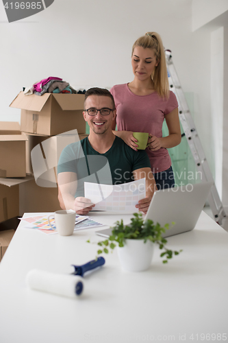 Image of Young couple moving in a new home