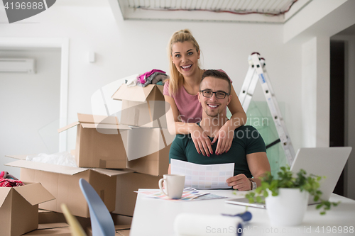 Image of Young couple moving in a new home