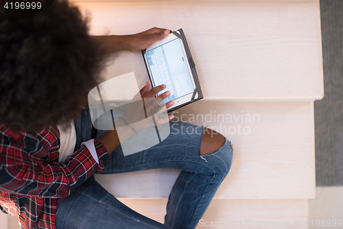 Image of black woman using her electronic tablet