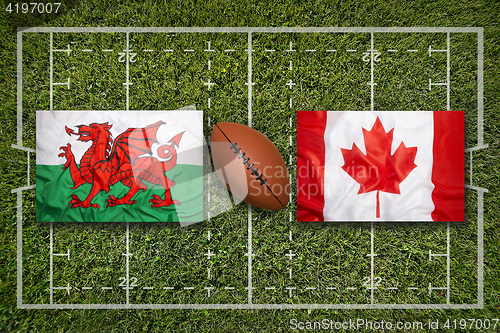 Image of Wales vs. Canada flags on rugby field