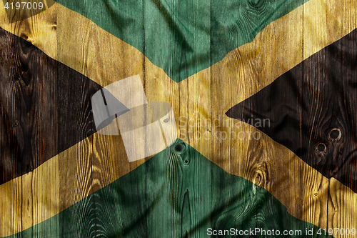 Image of National flag of Jamaica, wooden background