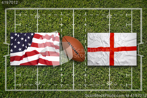 Image of USA vs. England flags on rugby field