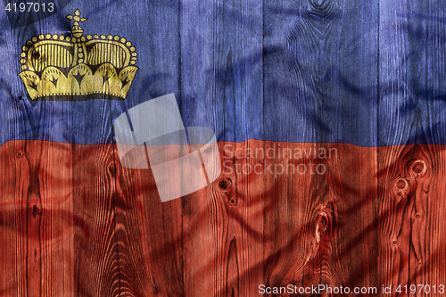 Image of National flag of Liechtenstein, wooden background