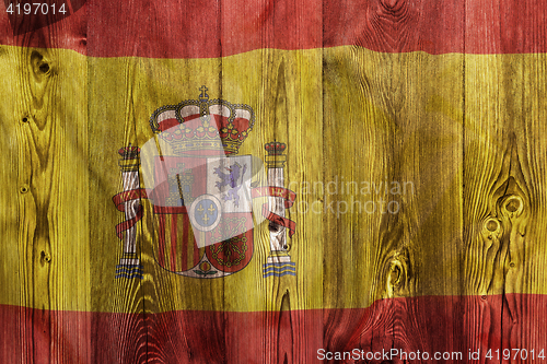Image of National flag of Spain, wooden background