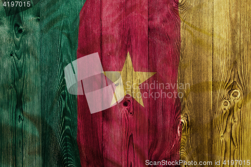 Image of National flag of Cameroon, wooden background