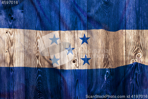 Image of National flag of Honduras, wooden background