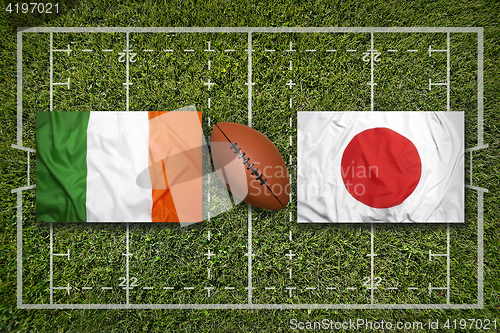 Image of Ireland vs. Japan\r flags on rugby field