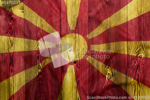 Image of National flag of Macedonia, wooden background
