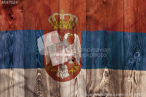 Image of National flag of Serbia, wooden background