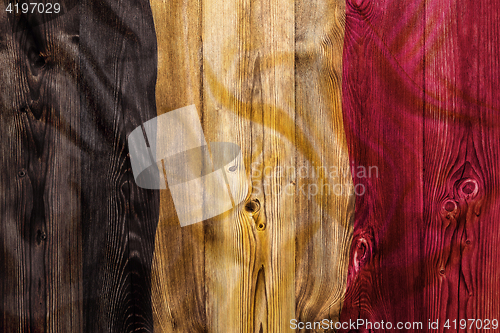 Image of National flag of Belgium, wooden background