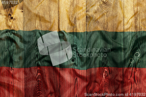 Image of National flag of Lithuania, wooden background