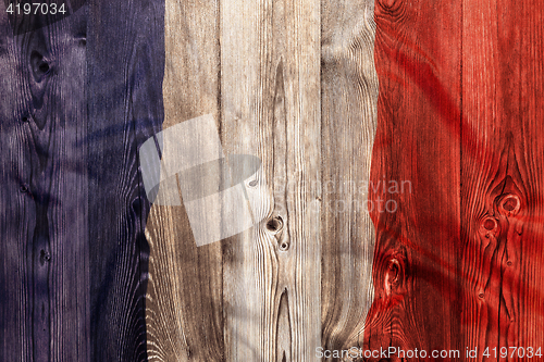 Image of National flag of France, wooden background