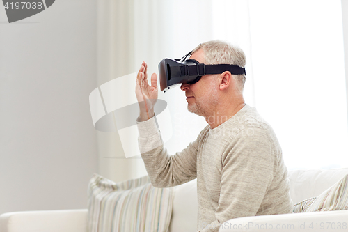 Image of old man in virtual reality headset or 3d glasses