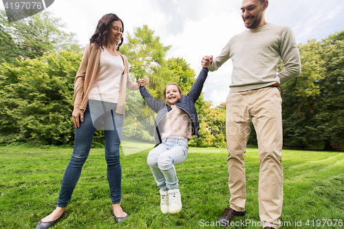 Image of happy family walking in summer park and having fun