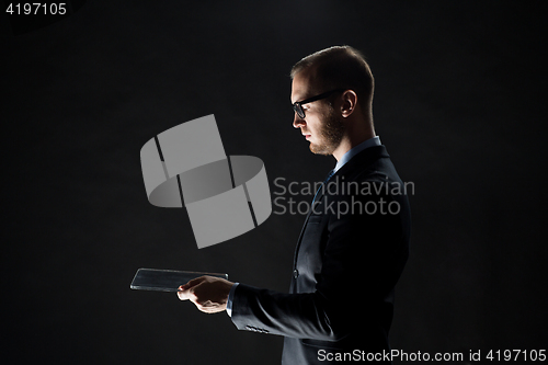 Image of close up of businessman with transparent tablet pc