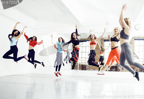 Image of Women doing sport in gym, jumping, healthcare lifestyle people concept, modern loft studio 