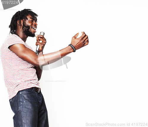 Image of young handsome african american boy singing emotional with microphone isolated on white background, in motion gesturing smiling, lifestyle people concept 