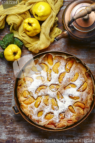 Image of Rustic baked pie with quince