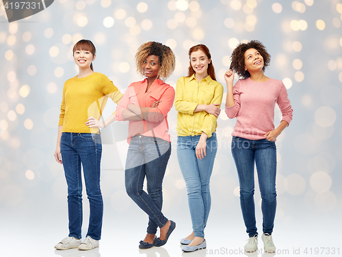 Image of happy young women over lights background