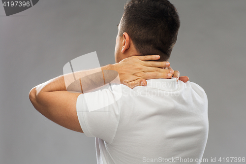 Image of close up of man suffering from neck pain