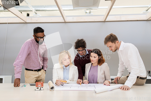 Image of business team discussing house project at office