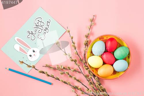 Image of The top view of easter on pink table office workplace