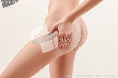 Image of Checking cellulite. Young, slim, healthy and beautiful woman