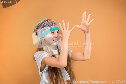 Image of The face of playful happy teen girl