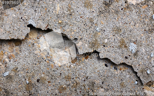 Image of Chipped and broken smooth concrete surface