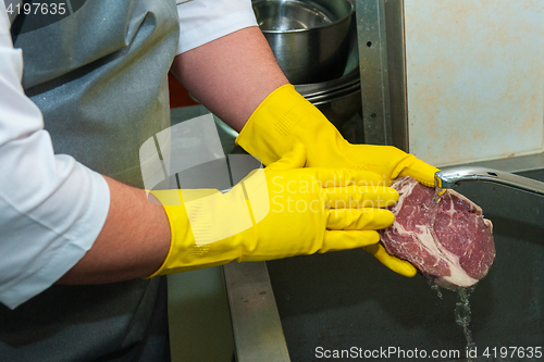 Image of washing and cleaning meat