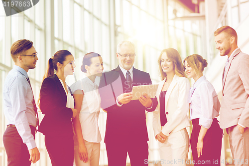 Image of business people with tablet pc computer at office