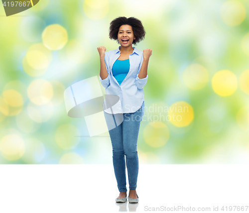 Image of happy african american young woman over white