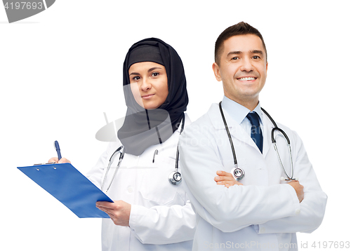 Image of happy doctors with clipboard and stethoscopes