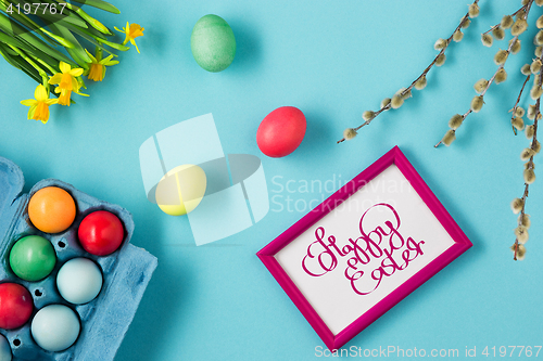 Image of The top view of easter on blue table office workplace