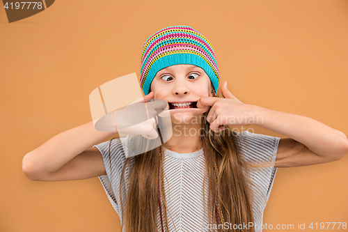 Image of The face of playful happy teen girl