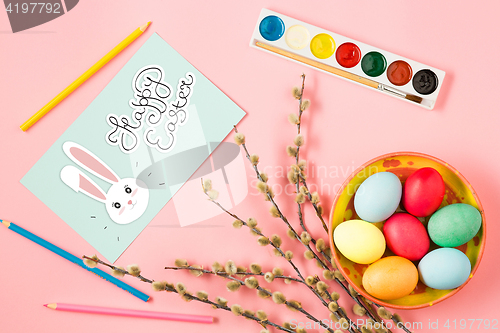 Image of The top view of easter on pink table office workplace