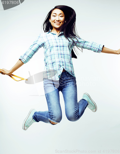 Image of young pretty jumping asian woman posing cheerful emotional isolated on white background, lifestyle people concept