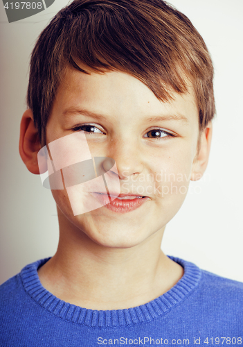 Image of young pretty little cute boy kid wondering, posing face isolated on white background, gesture happy smiling close up, lifestyle real people concept