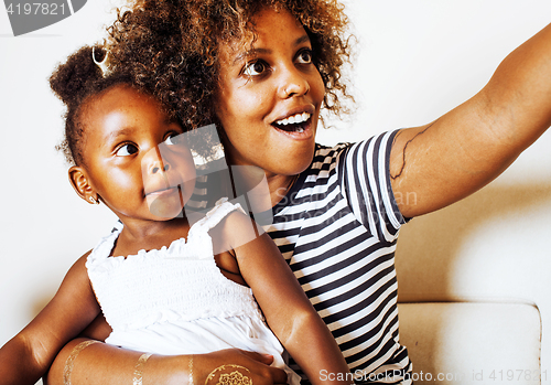 Image of adorable sweet young afro-american mother with cute little daugh