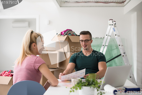 Image of Young couple moving in a new home