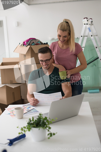 Image of Young couple moving in a new home