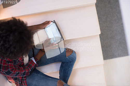 Image of black woman using her electronic tablet