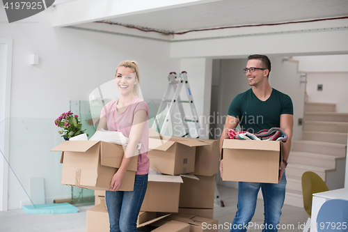 Image of young couple moving into a new home